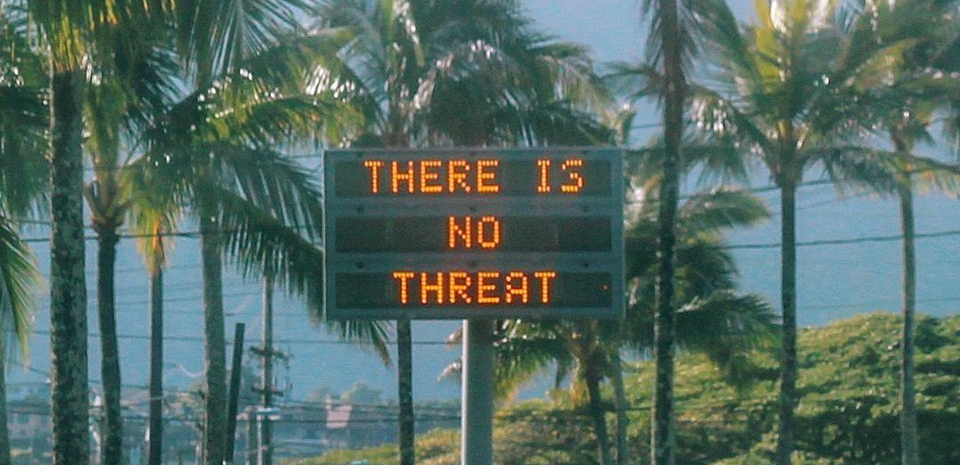 Hawaiian billboard showing "There is no threat" message