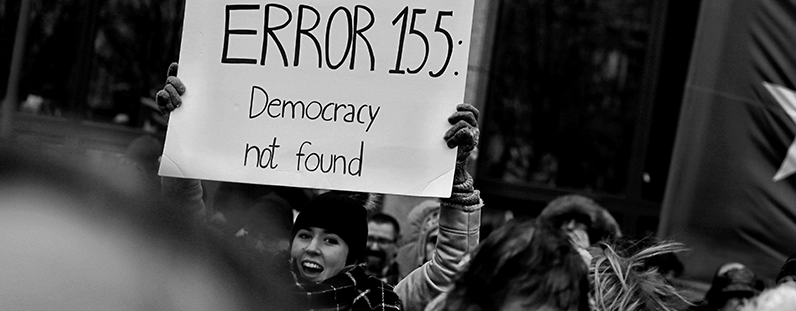 "Democracy not found" protest sign