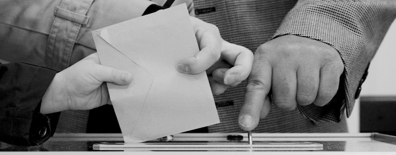 Voters submitting a ballot