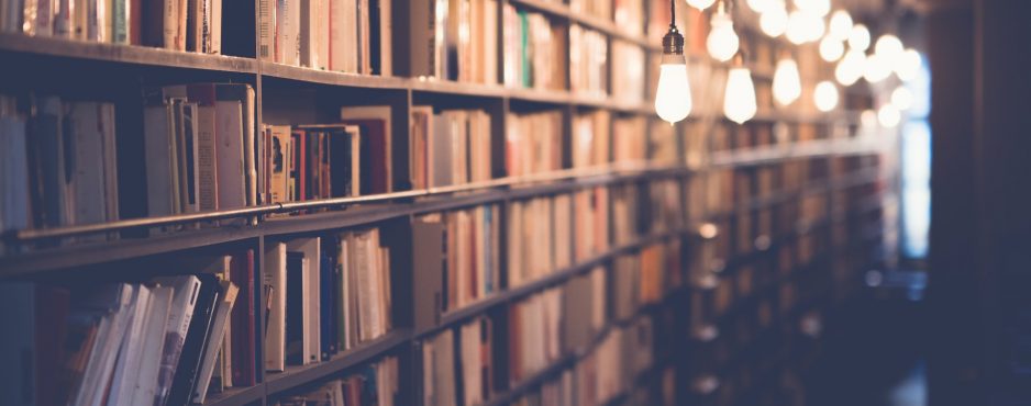 academic to user experience research shelves of books with edison lights