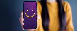 customer experience key components mobile phone screen purple background yellow smile