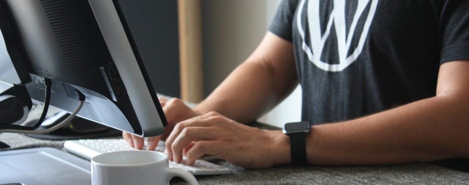 man in black tshirt on laptop improve customer experience